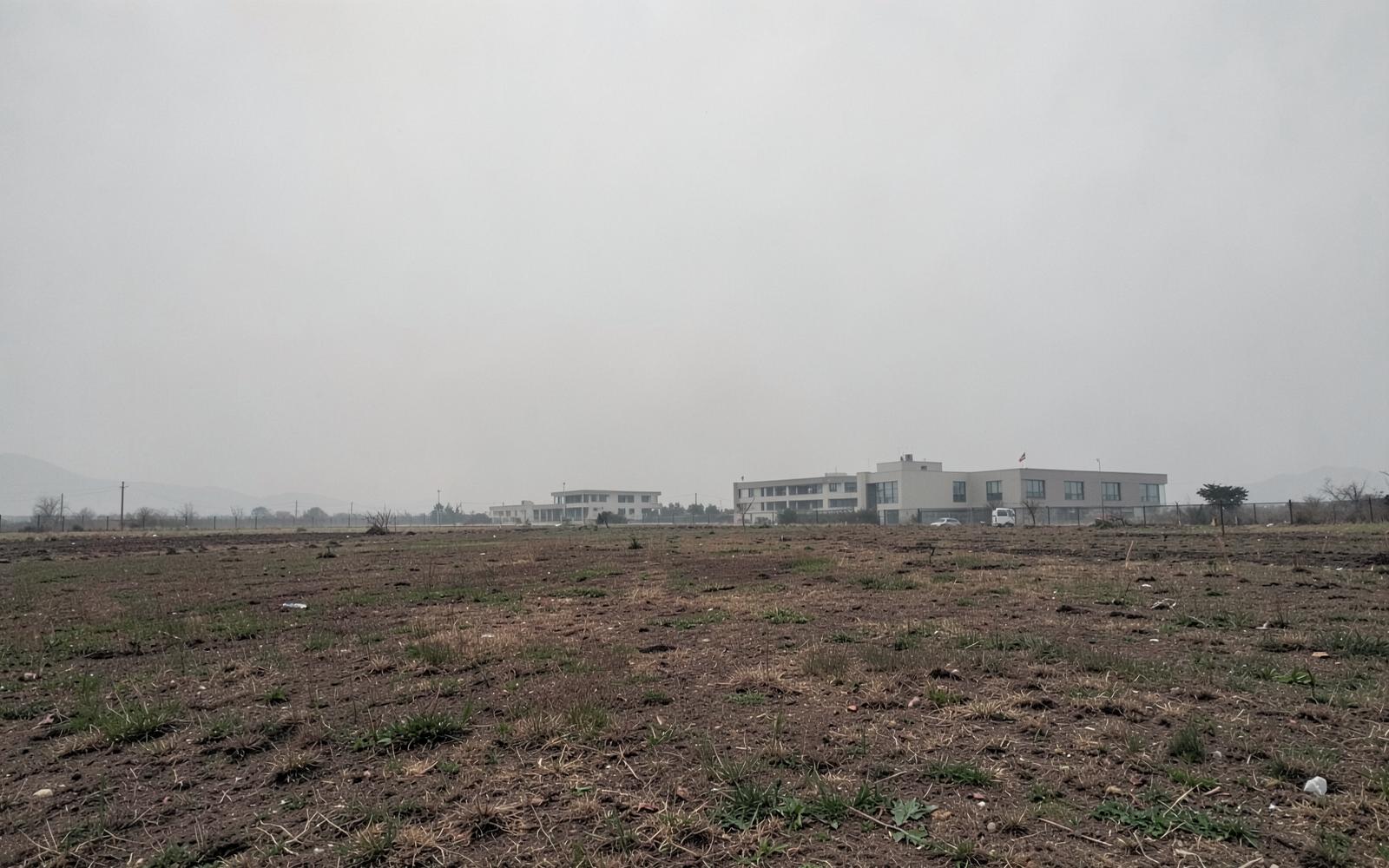 Neutral open site representing the planned Mardan campus